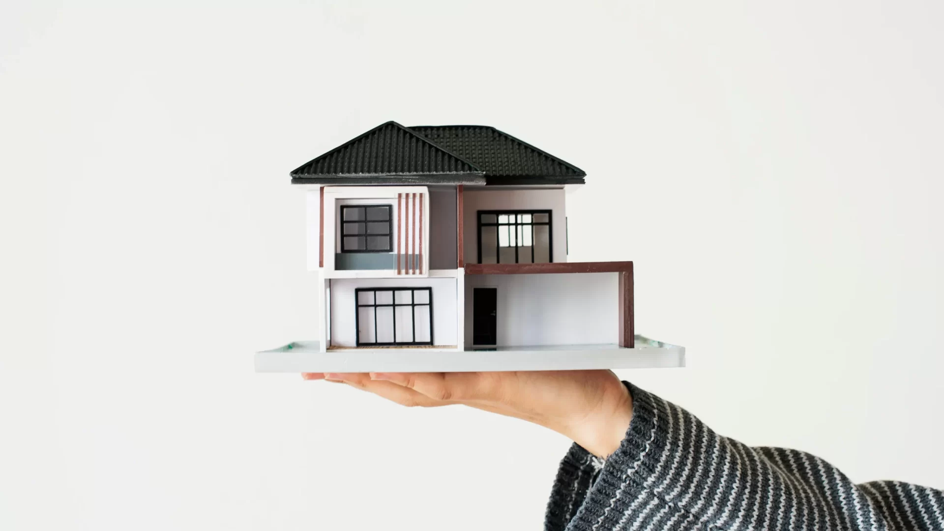 hand-presenting-model-house-home-loan-campaign